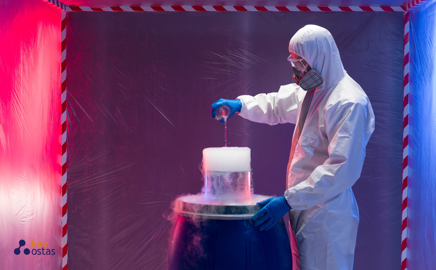 man wearing protective clothing ppe working with hazardous liquids