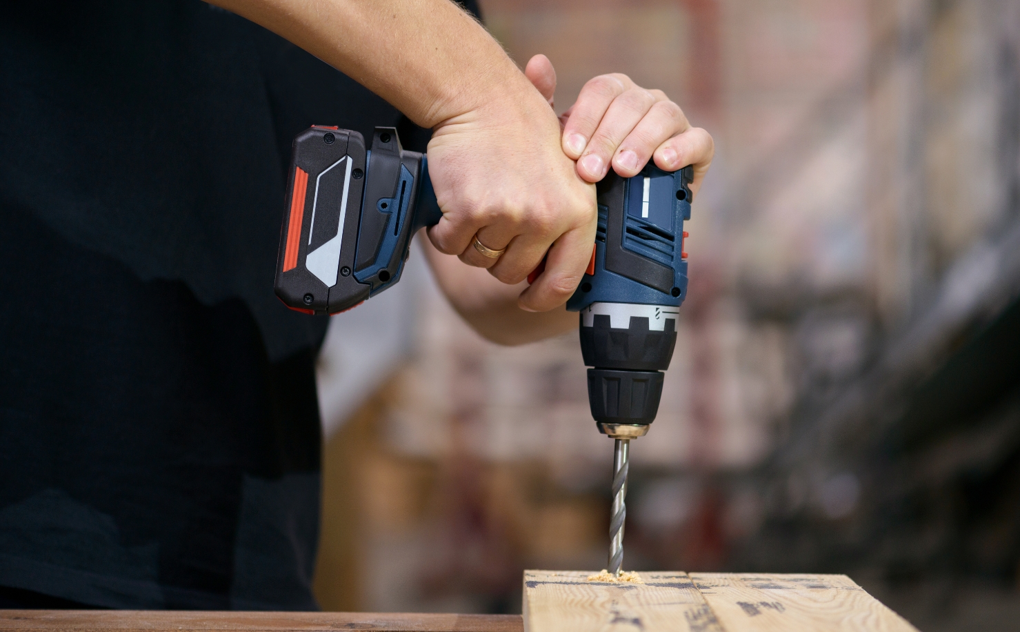 Hand Arm Vibration Syndrome man drilling into wood