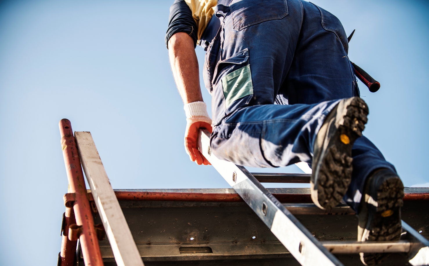 man climbing ladder