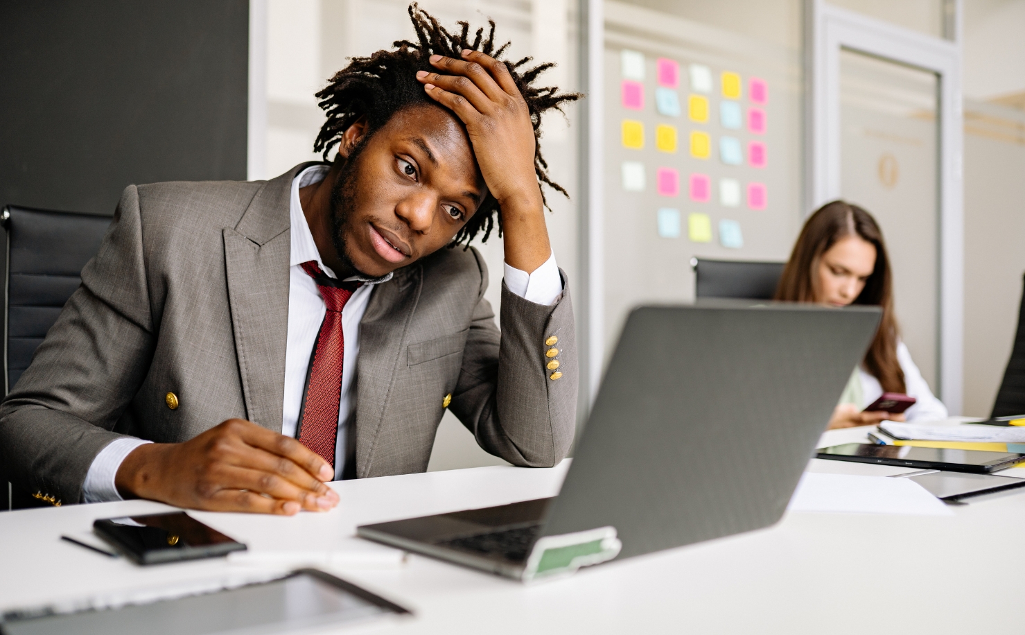 lonely man at office desk looking frustrated